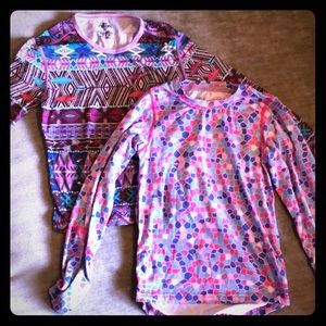 Two baselayer girls long sleeve shirts.